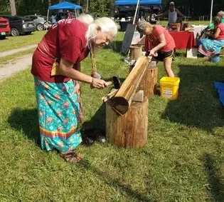 Pounding an ash log.
