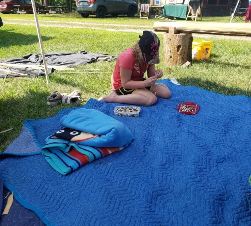 Beading on a blue blanket.