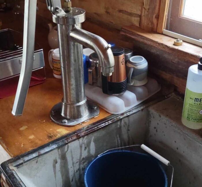 The hand pump inside the cabin