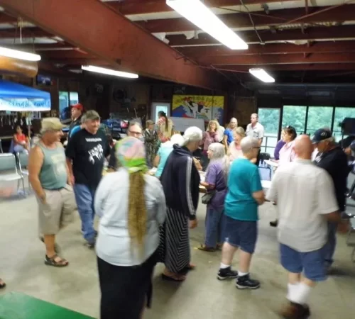 People visiting at the gathering.