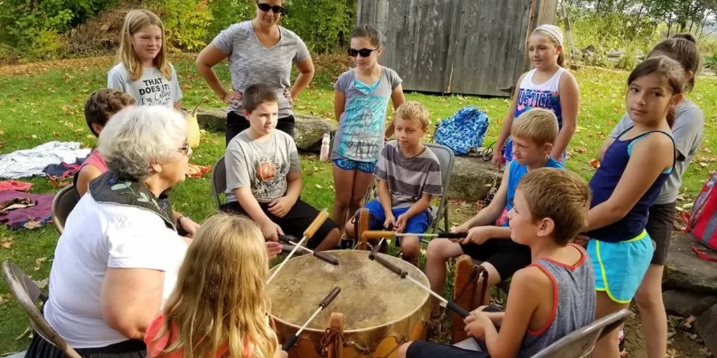 Children at Old Stone House Museum learning to drum.