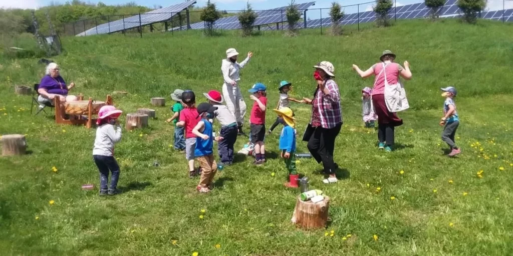 Children singing and dancing.
