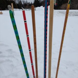 Brightly painted snowsnakes waiting for the games to begin.