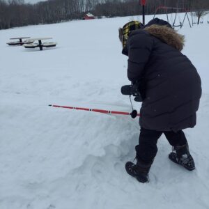 Throwing a bright red snowsnake.