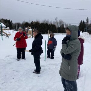 Watching the snowsnake game.