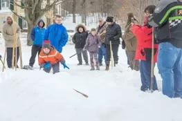 Playing snow snake games.