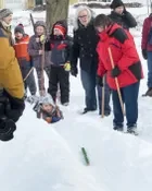 Playing snow snake games.
