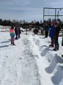 Playing snow snake games.