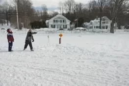 Playing snow snake games.