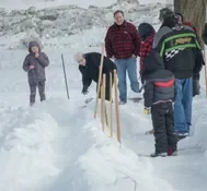 Playing snow snake games.