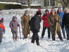 Playing snow snake games.