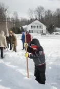 Playing snow snake games.