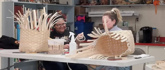 Weaving baskets.