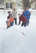 Playing snow snake games.