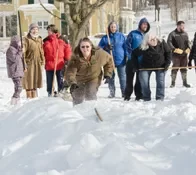 Playing snow snake games.