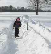 Playing snow snake games.