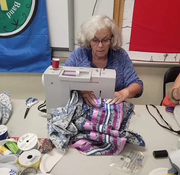 Making a ribbon skirt.