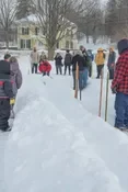 Playing snow snake games.