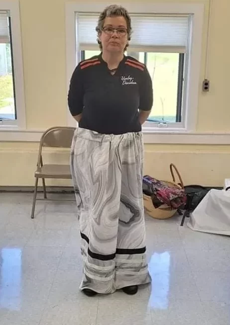 Showing of her ribbon skirt.