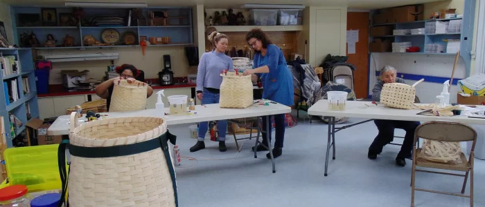 Working on pack baskets.
