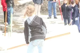 Playing snow snake games.