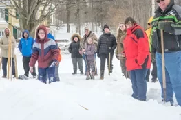 Playing snow snake games.